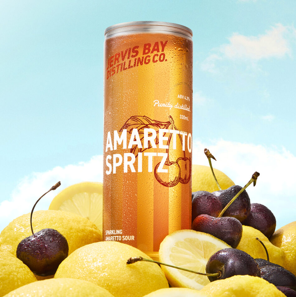 Jervis Bay Distilling Co. Amaretto Spritz RTD can with lemons and cherries against a bright sky